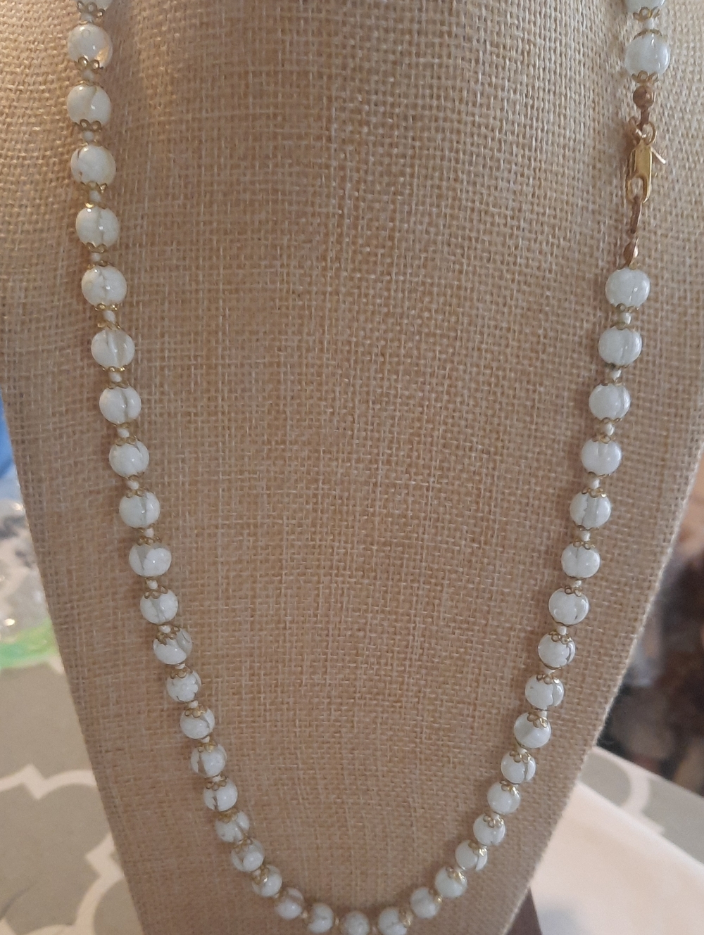 White Beaded Necklace with Gold Accents